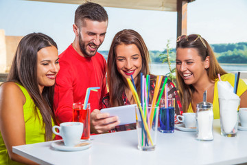 
Friends enjoy on holiday in the cafe.
