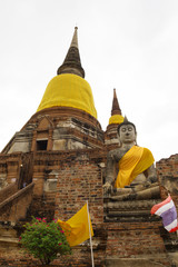Fototapeta na wymiar Pagoda and Buddha Status at Wat Yai Chaimongkol, Ayutthaya, Thailand 