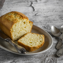 simple cake on an oval plate on a light wooden background