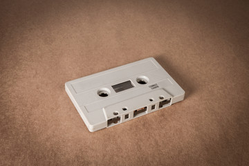 cassette tape on brown paper background. Vintage style