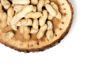 Pile of unshelled peanuts, isolated on white background
