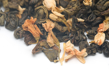 dry green tea with jasmine on a white background