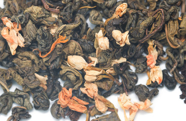 dry green tea with jasmine on a white background