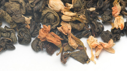 dry green tea with jasmine on a white background