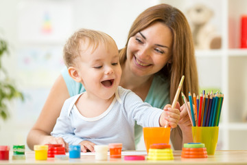 happy family mother and child painting together