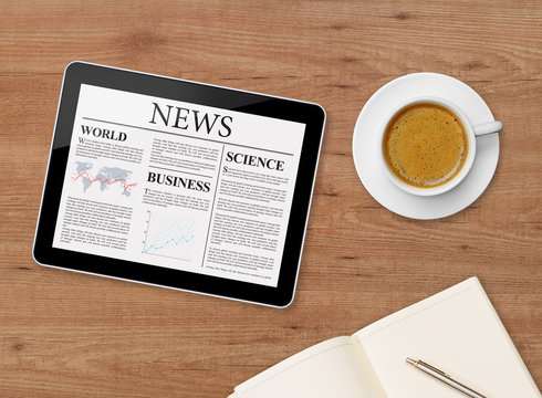 News page on tablet and coffee cup