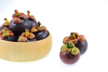 mangosteen on white background, the tropical purple fruit in Tha