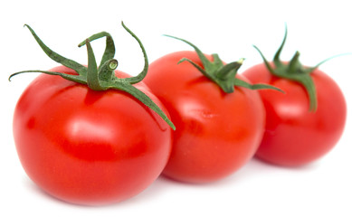 ripe tomatoes on a white background