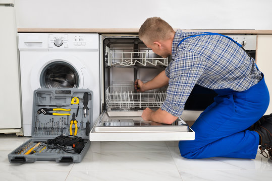 Man Repairing Dishwasher
