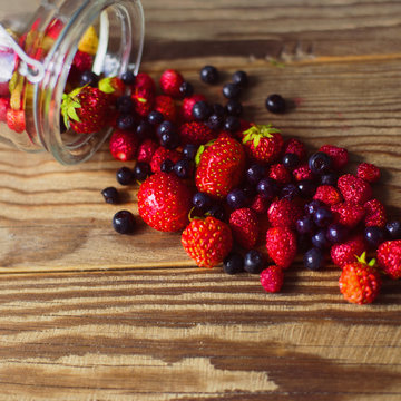 wild berries on wooden background