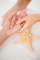 A woman having a hand massage 