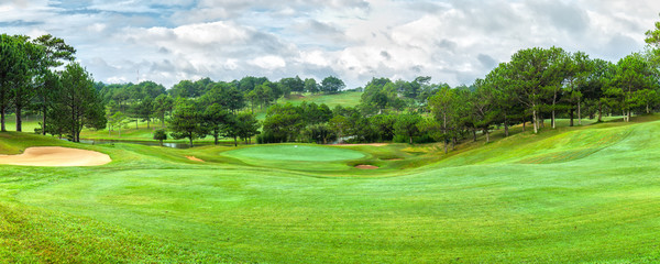 Dalat golf panorama sunny day with pine forests, vast lawns around the hill to create beauty when watching, golfing - obrazy, fototapety, plakaty