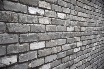 Grey brick wall with diminishing perspective