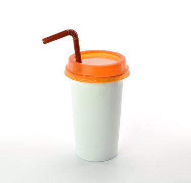 White plastic glass orange cap with straw on white background