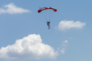 Paraglider flying in summer day