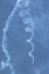 Show of airplanes creating smoke trails