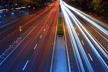 Long exposure photo of traffic with blurred traces from cars