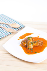 Canned fish in tomato sauce