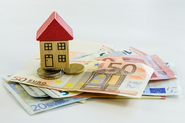 house, coins and banknotes