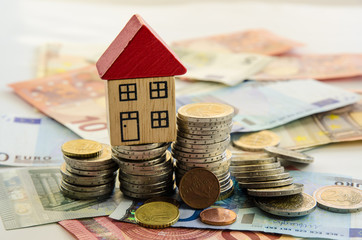 house, coins and banknotes