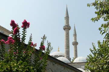 Fototapeta na wymiar minarets of the 16th century Atik Valide mosque built by master architect Sinan, Uskudar, Istanbul, Turkey