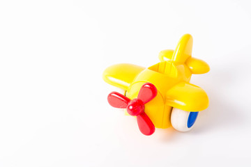 Yellow Plastic Toy Plane on White Background