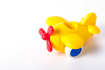 Yellow Plastic Toy Plane on White Background