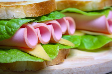 sandwich with ham, cheese and lettuce