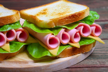 sandwich with ham, cheese and lettuce
