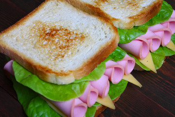 sandwich with ham, cheese and lettuce