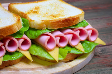 sandwich with ham, cheese and lettuce