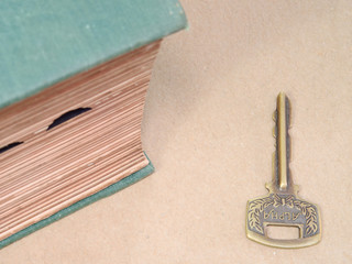 Knowledge Concept With Old Big Book And Key.