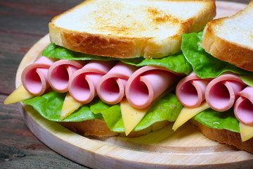sandwich with ham, cheese and lettuce