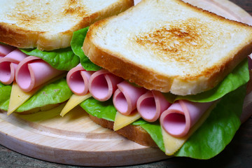 sandwich with ham, cheese and lettuce