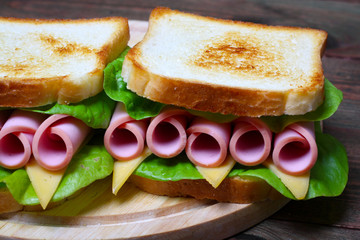 sandwich with ham, cheese and lettuce