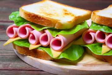 sandwich with ham, cheese and lettuce