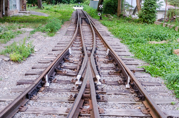 Fototapeta na wymiar The impasse and end rails to the index mark on the children's railway in Striysky Park in Lviv