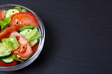 Fresh salad with tomatoes, cucumbers and lettuce