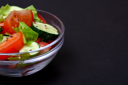 Fresh salad with tomatoes, cucumbers and lettuce