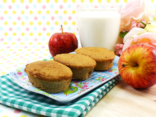 egg cake coffee flavor and red apple on sweet polka dot background