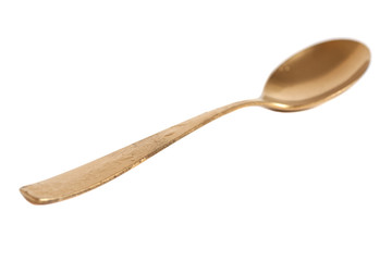 Golden spoon isolated on white