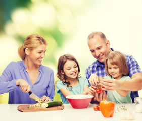 happy family with two kids making dinner at home