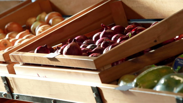 Fruit and vegetables in boxes at supermarket