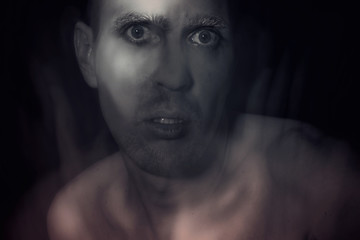 young man with the silver paint on his face