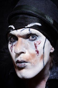 Portrait of a theatrical actor with dark makeup