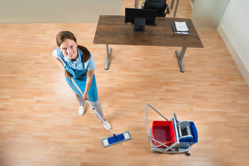 Janitor Mopping Floor In Office