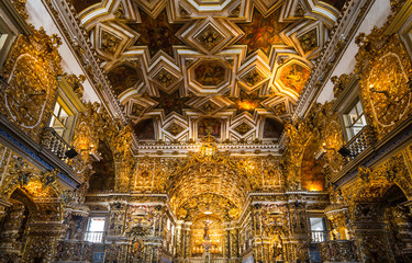 Fototapeta na wymiar Brazil, Salvador, statues of saints and gold decorations in the St. Francisco church