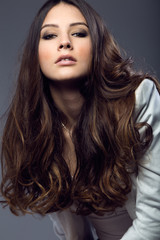 Portrait of pretty young woman posing in the studio photo.