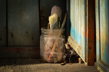 Old shabby dirty forgotten brushes in spiderweb, foretime, junk
