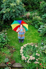 Woman holding colourful umbrella